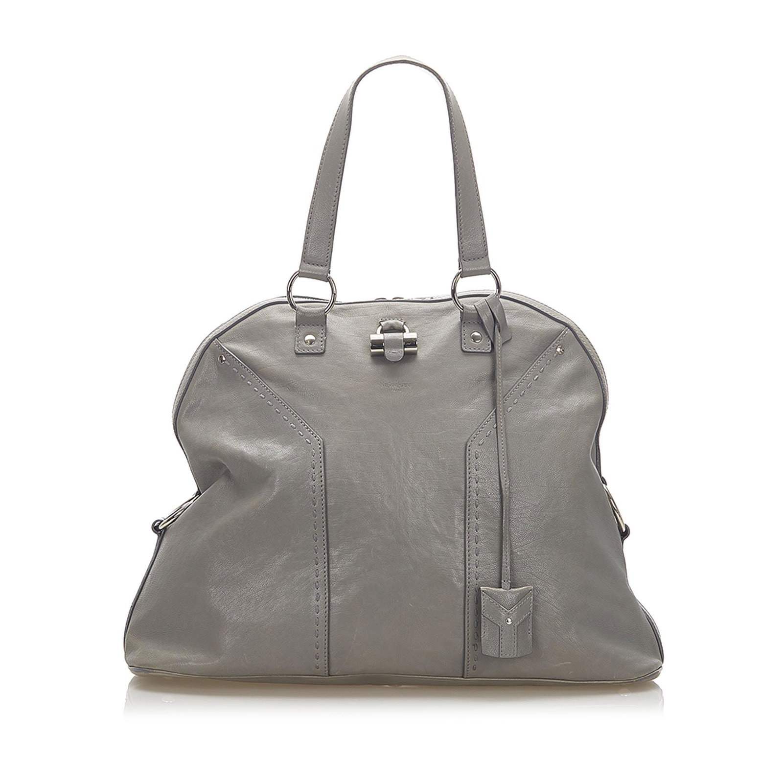 Authentic YSL Muse Leather Handbag: This item qualifies for FREE DOMESTIC SHIPPING to customers in the USA The Muse features a leather body flat leather straps silver-tone hardware a clochette a top zip closure and an interior zip pocke