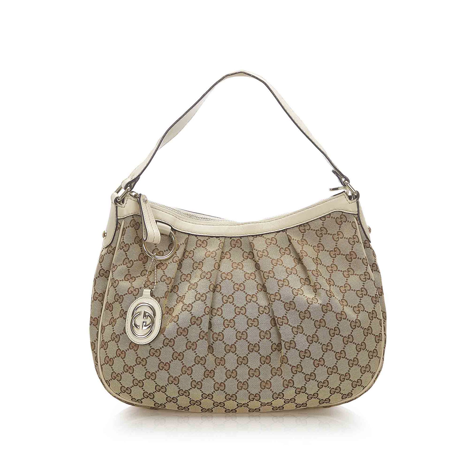 Authentic Gucci GG Canvas Sukey Shoulder Bag: This item qualifies for FREE DOMESTIC SHIPPING to customers in the USA This Sukey shoulder bag features a canvas body with leather trim a flat leather strap a top zip closure and an interior zip and s