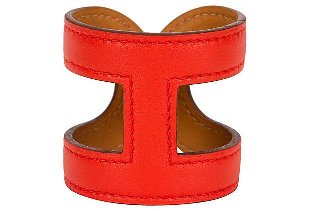 Authentic Hermes Capucine Stretch Leather Cuff: This item qualifies for FREE DOMESTIC SHIPPING to customers in the USA Condition: New Era: Contemporary; 2000s Dimensions: 2.5" W x 2" H Materials: leather Color: capucine HermeÌ€s stretch capucine