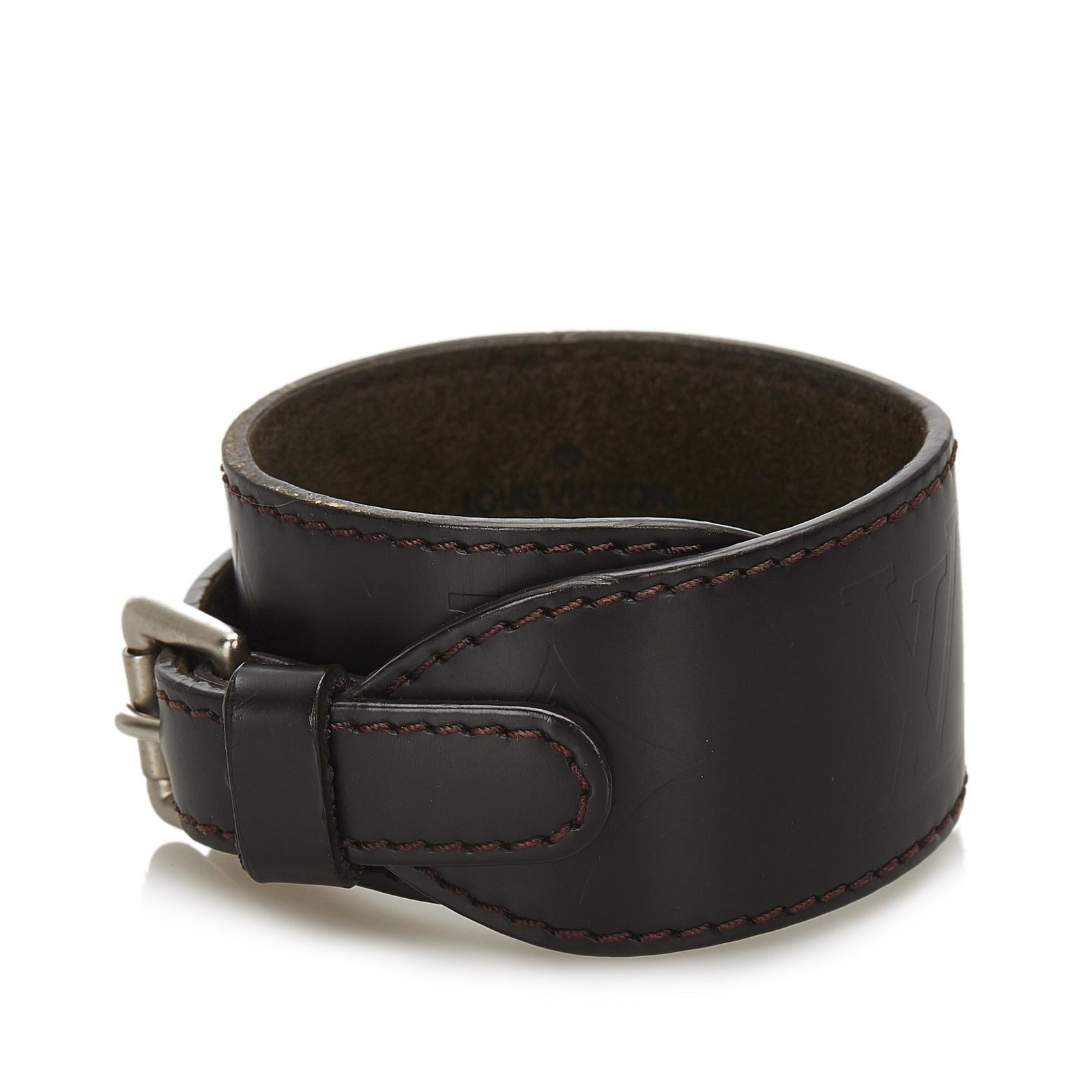 Authentic Louis Vuitton Monogram Glace Cuff Bracelet: This item qualifies for FREE DOMESTIC SHIPPING to customers in the USA This cuff bracelet features a monogram glace leather wrist strap and a silver-tone buckle closure. Brand: Louis Vuitton Model: Mo