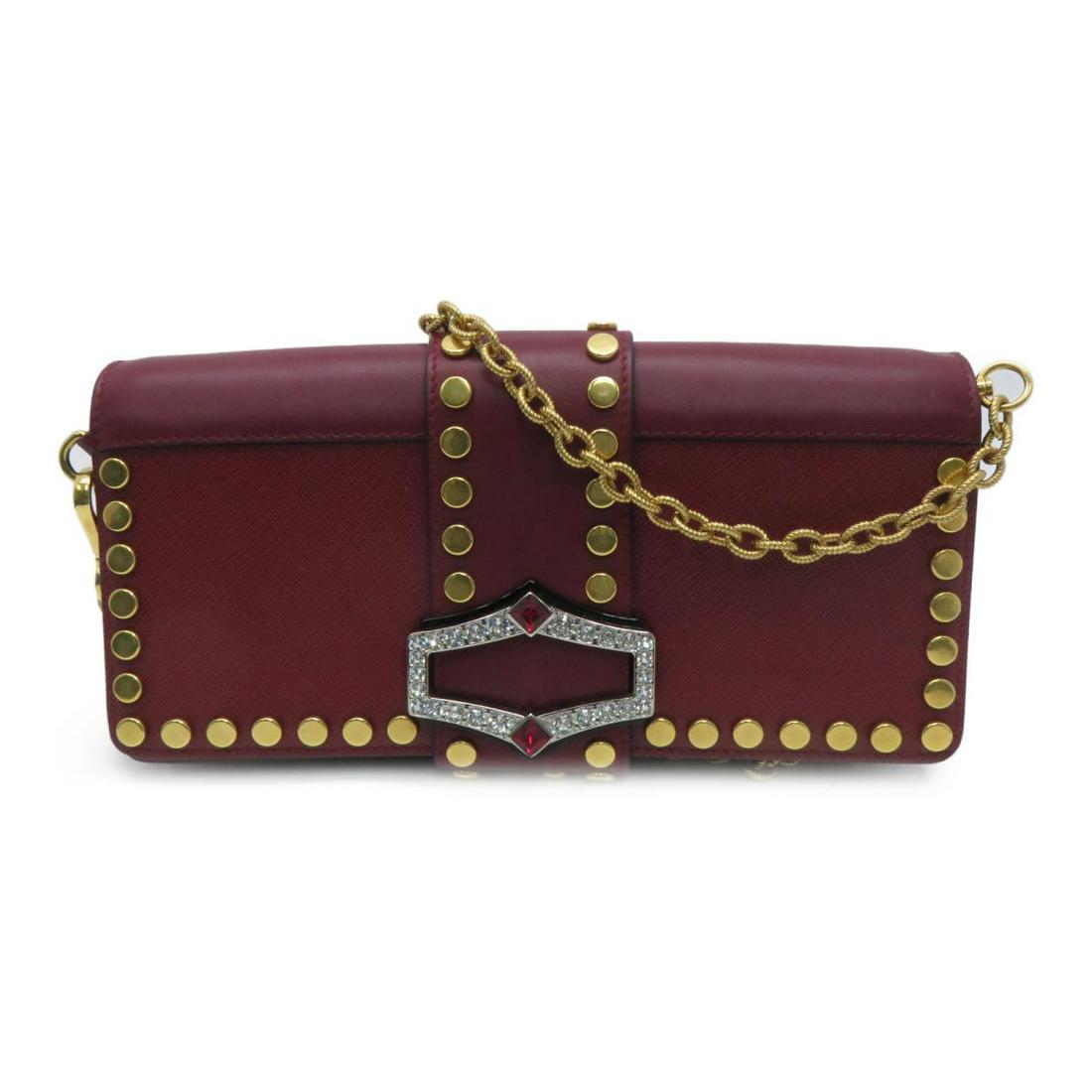 Authentic PRADA Shoulder Bag Red Saffiano: This item qualifies for FREE DOMESTIC SHIPPING to customers in the USA PRADA Shoulder Bag Red Saffiano Dimensions: W25Ã—H11Ã—D5cm/Shoulder Strap 100cm The BIDHAUS Guarantee: Photos descriptions 