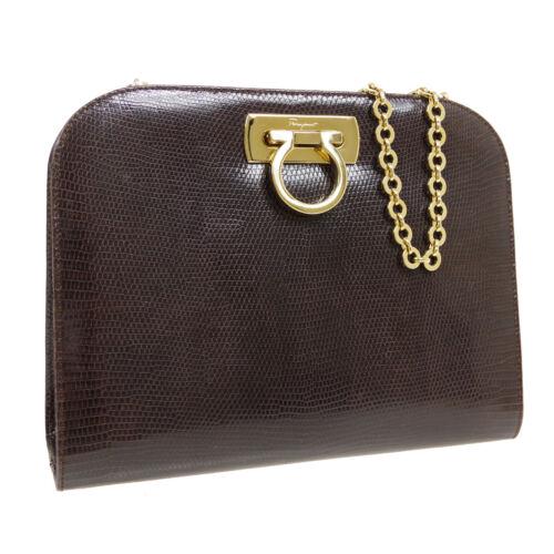 Authentic Salvatore Ferragamo Gancini Cross Body Chain: This item qualifies for FREE DOMESTIC SHIPPING to customers in the USA Size: Medium Features: Chain Strap Inner Pockets Detachable Strap Accents: Logo Color: Dark Brown Model: Salvatore Ferragamo Ganc
