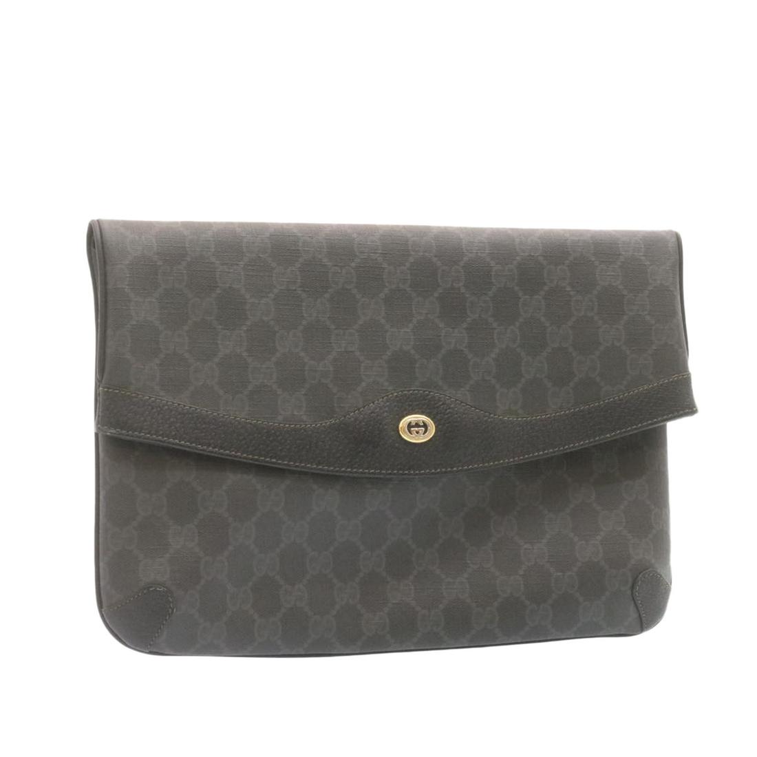 Authentic GUCCI GG Canvas Clutch Bag Black PVC Leather: This item qualifies for FREE DOMESTIC SHIPPING to customers in the USA Brand: GUCCI Style: Clutch Bag Material: PVC Leather Color: Black Made In: Italy Size (Inches): W12.59 x H8.66 x D1.57inch(Approx