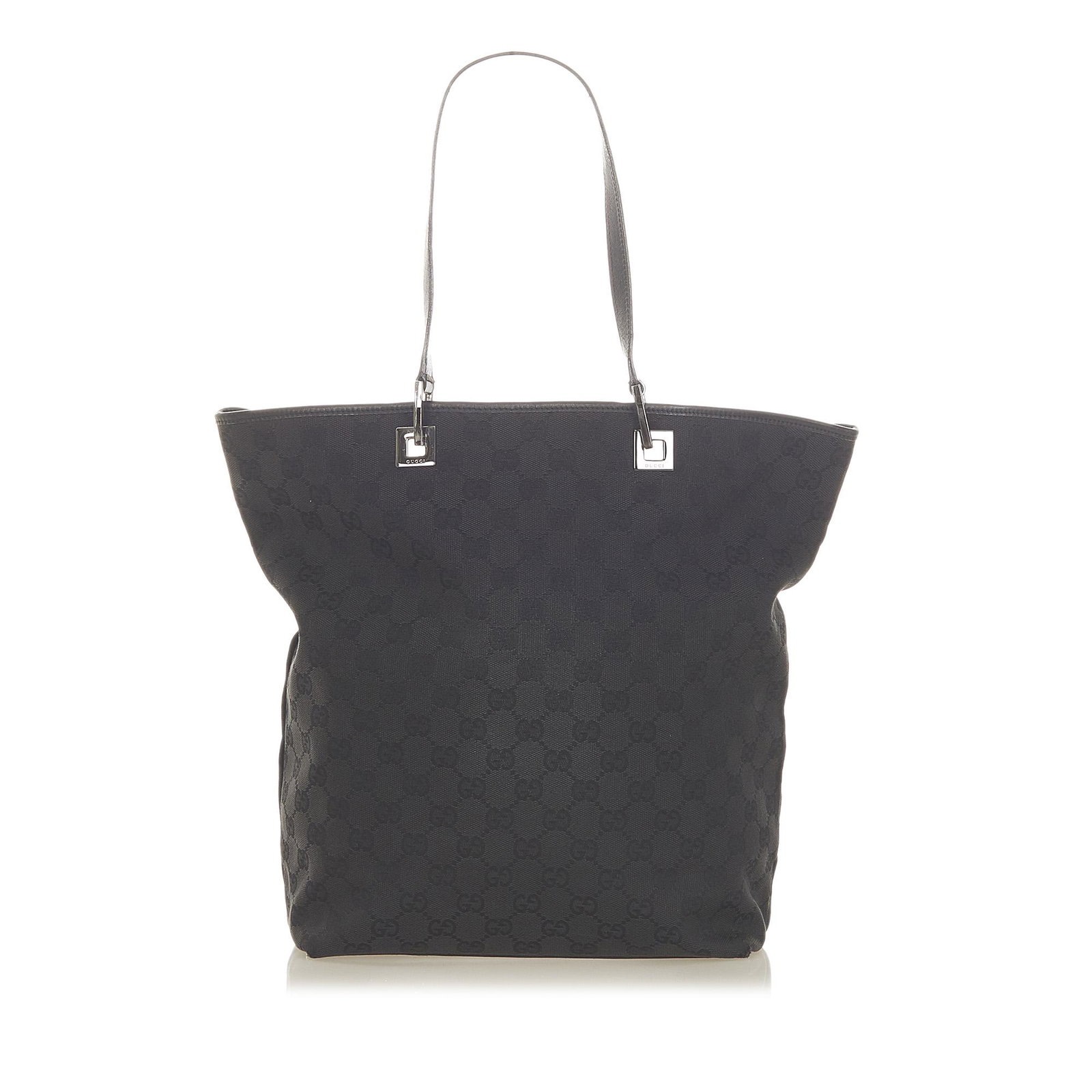 Authentic Gucci GG Canvas Tote Bag: This item qualifies for FREE DOMESTIC SHIPPING to customers in the USA This tote bag features a canvas body flat leather straps an open top and an interior zip pocket. Brand: Gucci Model: GG Canvas To