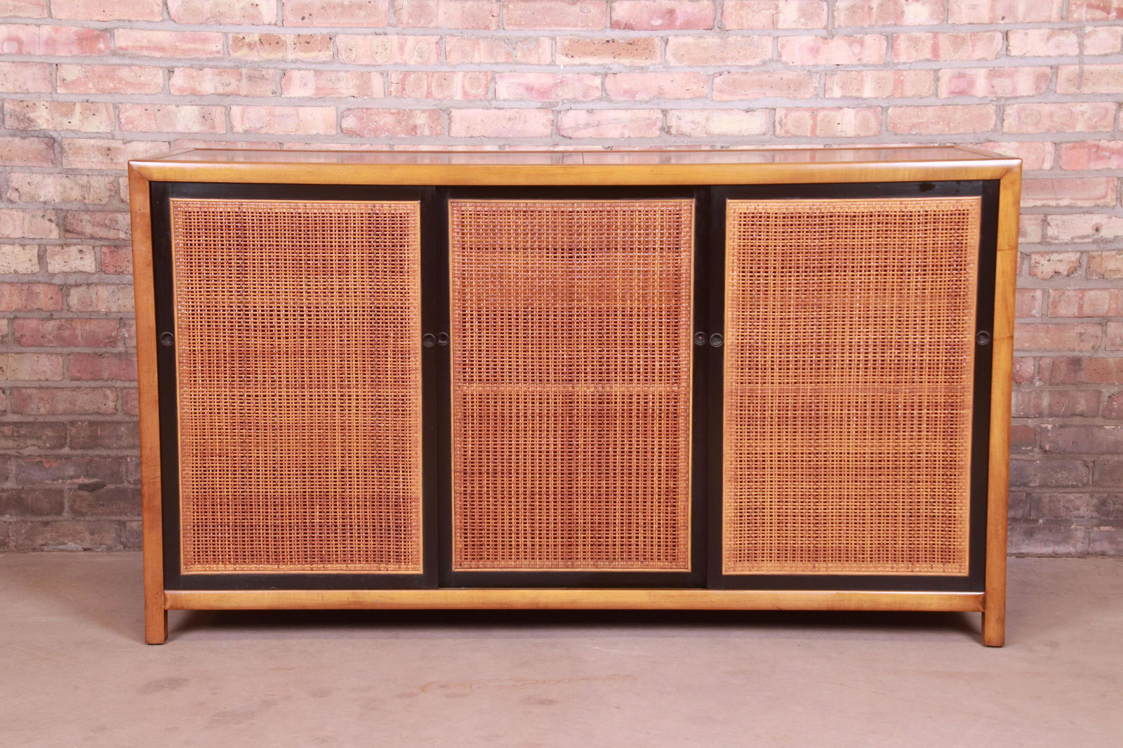 Michael Taylor for Baker Furniture New World Collection: An exceptional mid-century modern Hollywood Regency Chinoiserie sideboard credenza or bar cabinet By Michael Taylor for Baker Furniture "New World Collection" USA 1950s Cherry wood with black lacquere