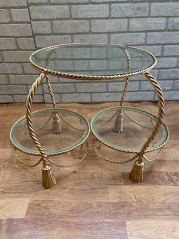 Hollywood Regency Italian Gold Gilt Rope and Tassel 2: Vintage Hollywood Regency Italian Gold Gilt Rope and Tassel 2 Tier Accent Etagere Table Circa 1960 W 25 H 17 D 16 Good condition The BIDHAUS Guarantee: Photos descriptions and estimates were prepared