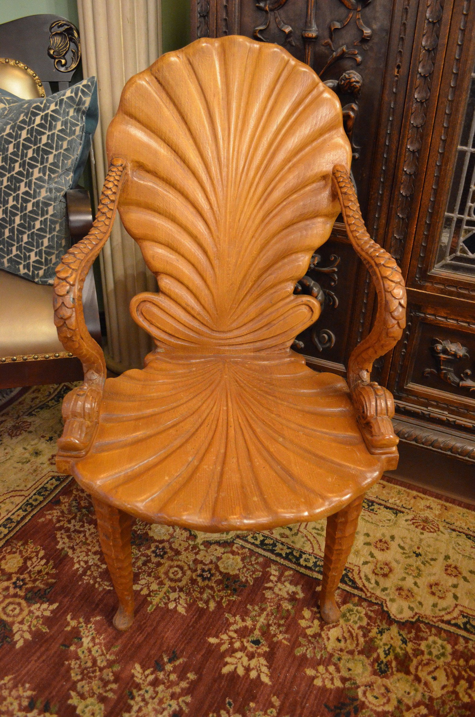 Italian Carved Wood Fantasy Grotto Chair with Dolphin: Vintage Italian Carved Wood Fantasy Grotto Chair with Dolphin Arms and Sea Shell Back Circa 1970 H 38 W 21 D 17 Seat H 16 Arm H 27 Good condition The BIDHAUS Guarantee: Photos descriptions