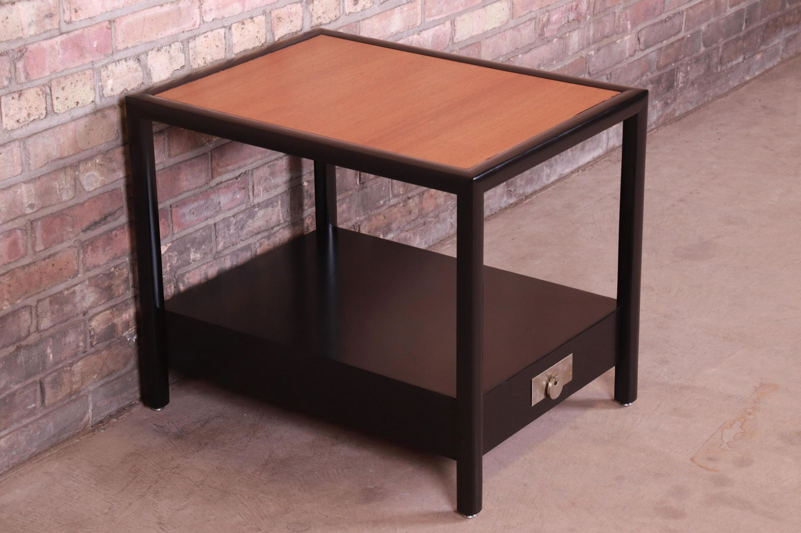 Michael Taylor for Baker Furniture New World Collection: An exceptional mid-century modern Chinoiserie nightstand or side table. By Michael Taylor for Baker Furniture "New World Collection" USA 1950s Black lacquered walnut with walnut top and original Asian