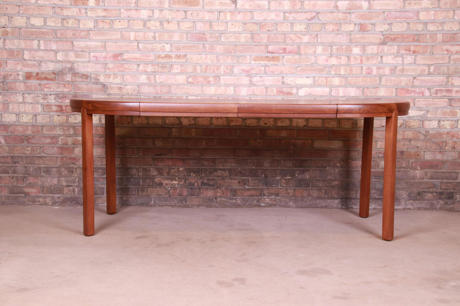 Michael Taylor for Baker Furniture Walnut Extension: An exceptional mid-century modern extension dining or game table By Michael Taylor for Baker Furniture USA Circa 1960s Measures: 36"W x 36"D x 29.25"H. Extends up to 76"W with two 20" leaves. Knee cle