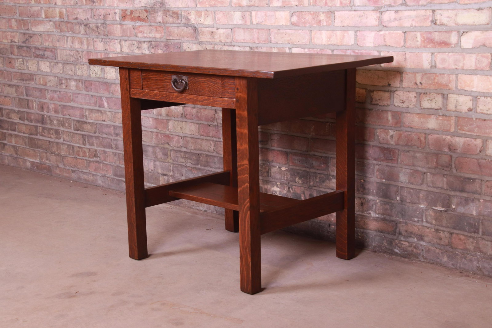 Signed Gustav Stickley Mission Oak Arts & Crafts Desk: A rare and exceptional antique Mission oak Arts & Crafts writing desk or library table By Gustav Stickley (original label present) USA Circa 1900 Solid quarter sawn oak with original copper hardwa