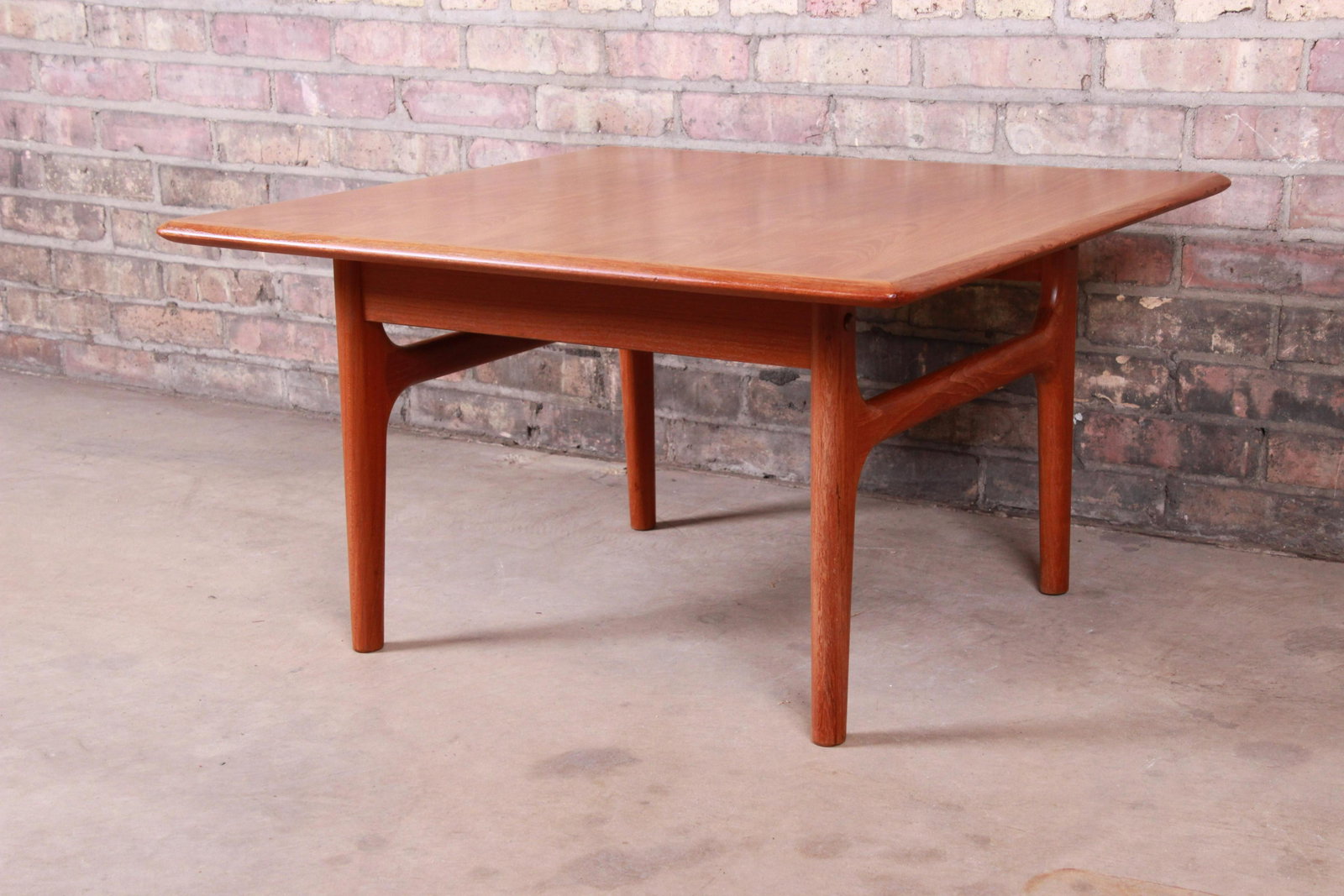 Danish Modern Sculpted Teak Occasional Side Table by: A sleek and stylish sculpted teak occasional side table or coffee table By Trioh MÃ¸belfabrik Denmark Circa 1960s Measures: 29.63"W x 29.63"D x 16.75"H. Very good original vintage condition. Dimensi