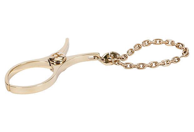 Authentic Hermes Goldtone Glove Clip: This item qualifies for FREE DOMESTIC SHIPPING to customers in the USA Condition: New Era: Contemporary; 2000s Dimensions: 2" L x 1" W Materials: metal Color: gold HermÃ¨s goldtone metal glove clip 