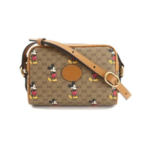 Authentic GUCCI Disney Mickey Mouse Mini GG Supreme: This item qualifies for FREE DOMESTIC SHIPPING to customers in the USA Brand: Gucci Size H: 4.72 Inch Style: Shoulder Bag Size D: 2.36 Inch Material: Mini Gg Supreme Canvas Leather Weight: 0.51 Lb Col