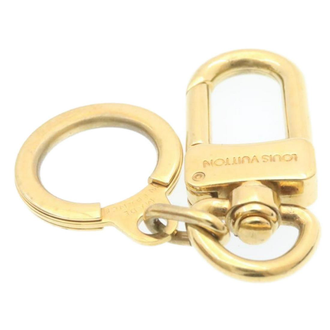 Authentic LOUIS VUITTON Anneau Cles Key Holder Charm: This item qualifies for FREE DOMESTIC SHIPPING to customers in the USA Brand: LOUIS VUITTON Style: Key Ring Material: Metal Color: Gold Tone Made In: France Size (Inches): - Exterior Condition: Metal 
