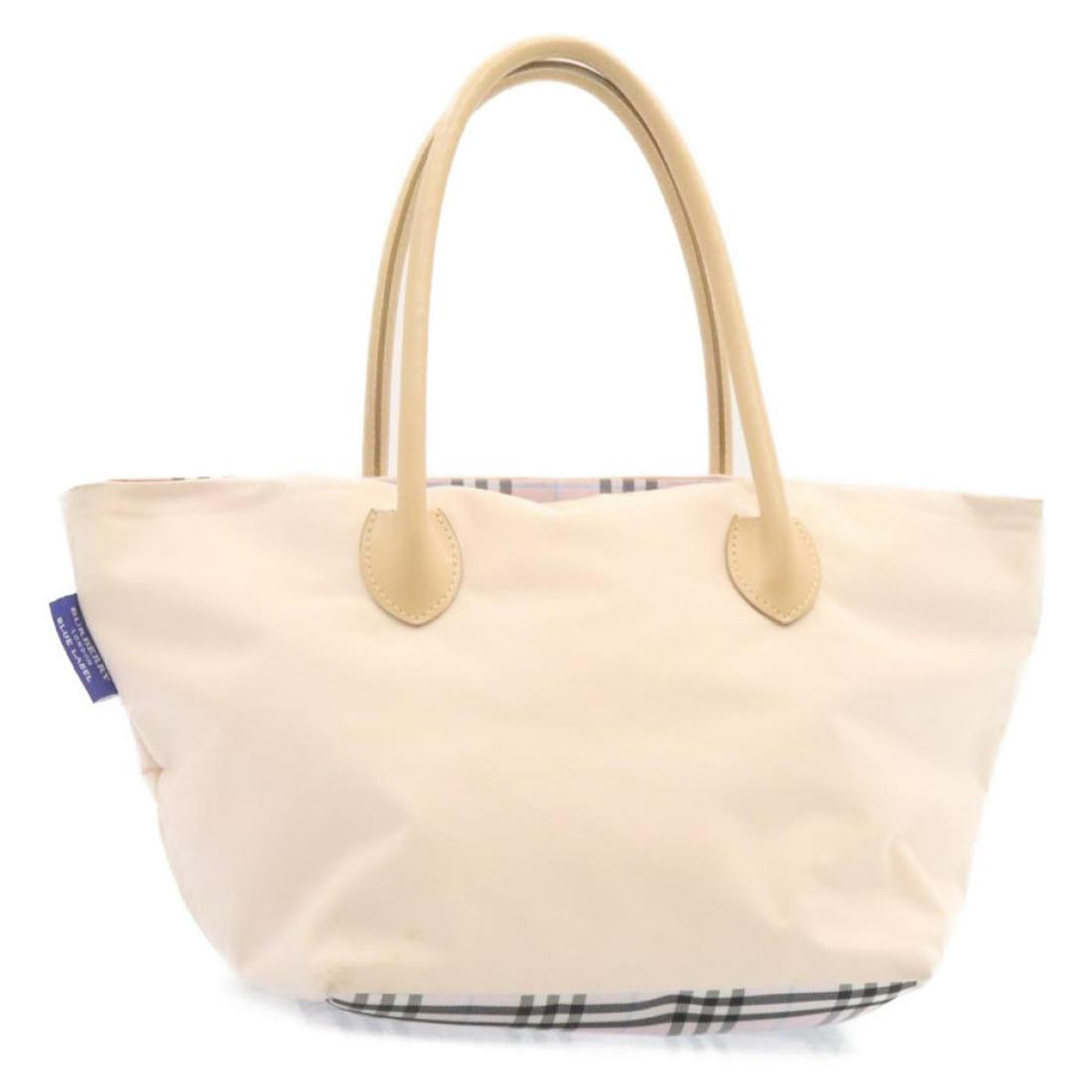 Authentic BURBERRY Blue label Nova Check Tote Bag Nylon: This item qualifies for FREE DOMESTIC SHIPPING to customers in the USA Brand: BURBERRY Style: Tote Bag Material: Nylon Color: Beige / Pink Made In: - Size (Inches): W17.7 x H9.4 x D9.1inch(Approx) / H