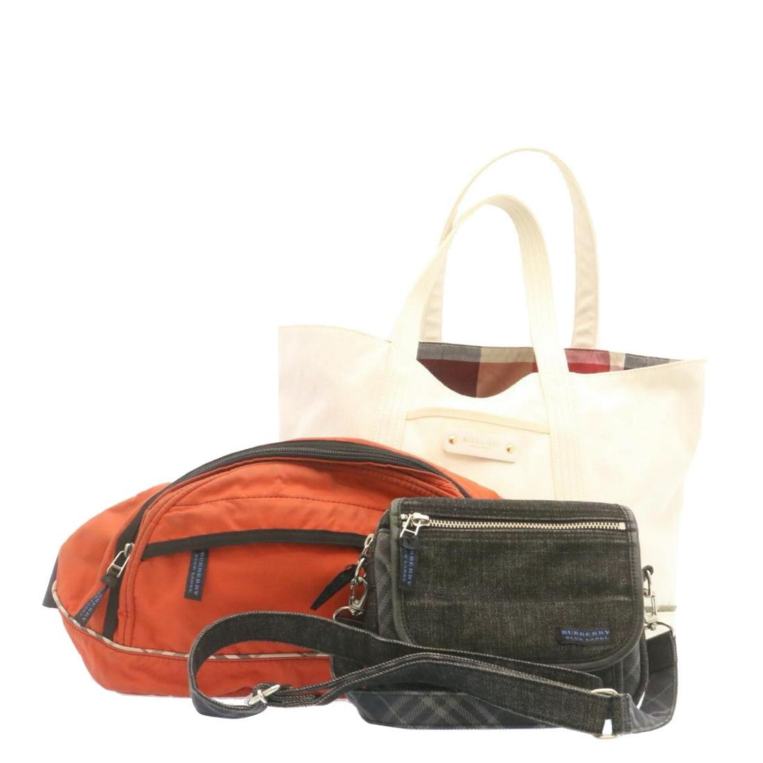 Authentic BURBERRY Blue label Shoulder Tote Bag Canvas: This item qualifies for FREE DOMESTIC SHIPPING to customers in the USA Brand: BURBERRY Style: Tote Bag Material: Canvas Color: Beige / Black / Orange Made In: - Size (Inches): - Exterior Condition: Su