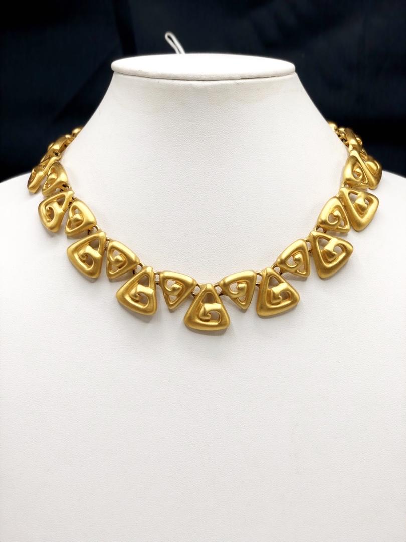 Authentic Anne Klein Aztec Inspired Necklace: This item qualifies for FREE DOMESTIC SHIPPING to customers in the USA Brand: Anne KleinMaterial: Gold-platedclaspHallmark : "Anne Klein"Country of Origin: USA The BIDHAUS Guarantee: Photos descriptio