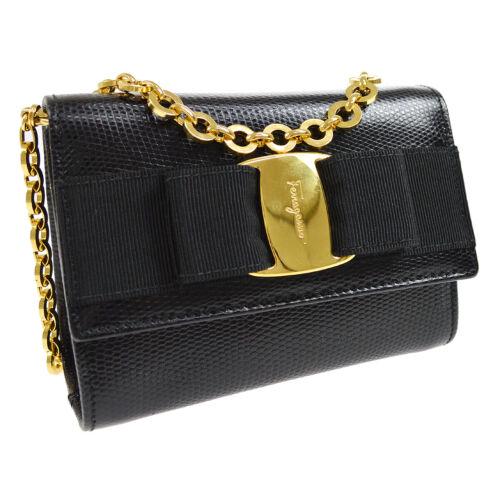Authentic Salvatore Ferragamo Vara Bow Chain Shoulder: This item qualifies for FREE DOMESTIC SHIPPING to customers in the USA Size: Small Pattern: Vara Bow Accents: Bow Logo Features: Chain Strap Detachable Strap Inner Pockets Model: Salvatore Ferragamo V