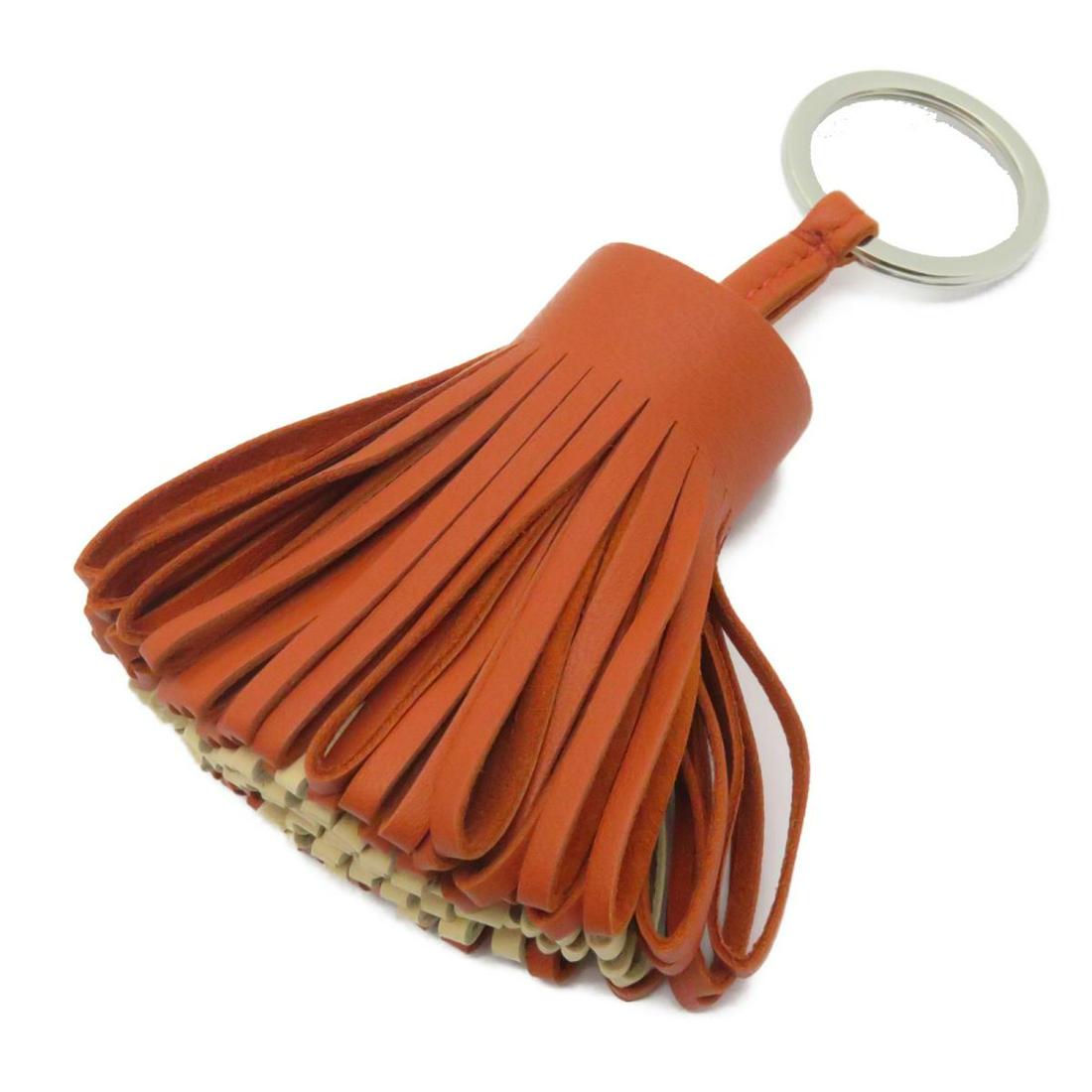 Authentic HERMES Carmen Charm Orange Lambskin: This item qualifies for FREE DOMESTIC SHIPPING to customers in the USA Brand: HERMES Model: HERMES Carmen Charm Orange Lambskin Category: Women Accessory Color: Orange Dimensions: W8Ã—H6cm The BIDH