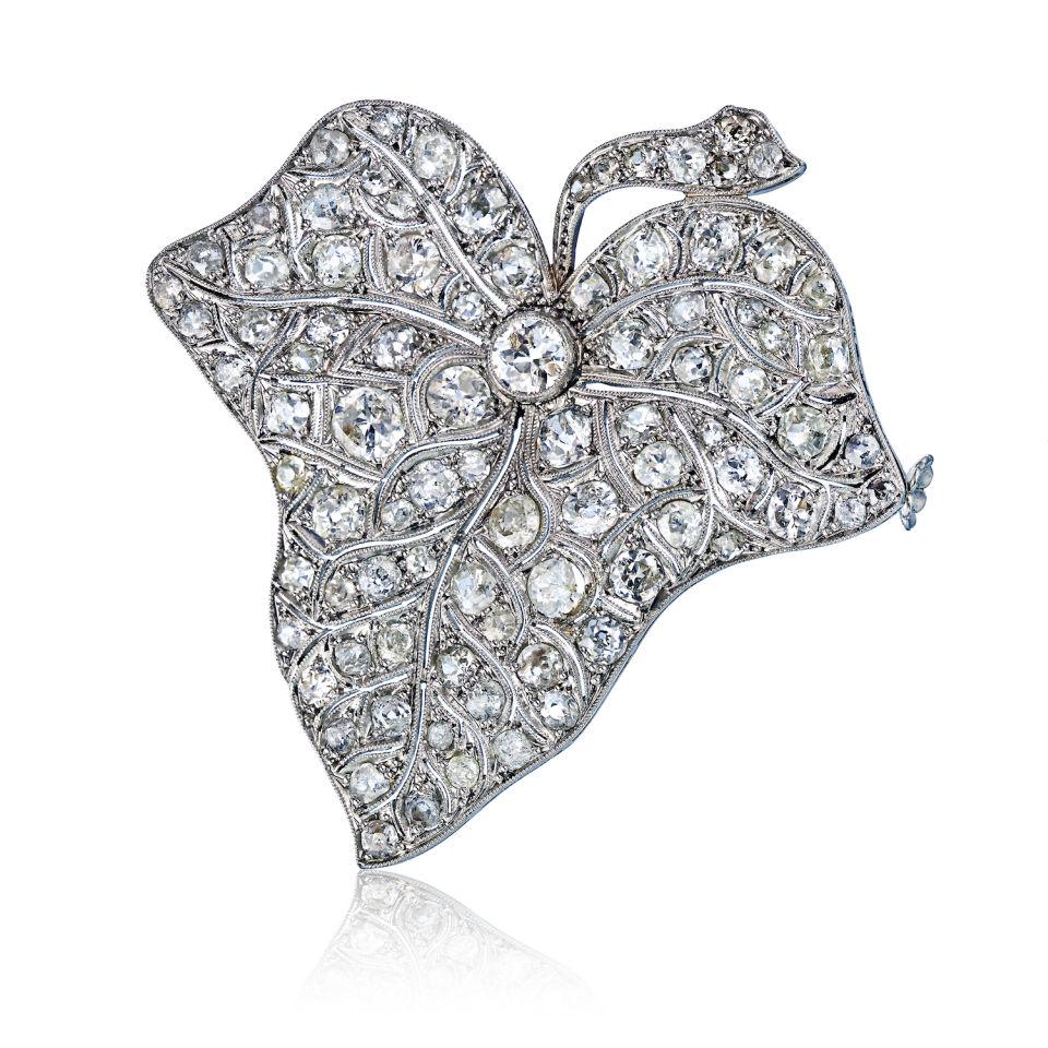 Art Deco Platinum Leaf Brooch: This item qualifies for FREE DOMESTIC SHIPPING to customers in the USA Type: Brooches Metal: Platinum Grams: 22.7 Approximate Diamond Weight: 12 Cts Style: Art Deco Other Details: Art Deco Platinum Le