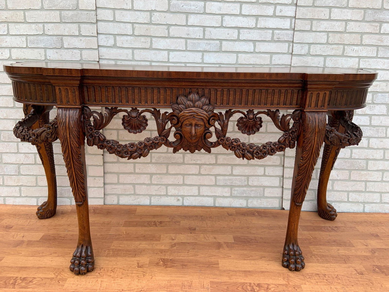 Maitland Smith Carved Ornate Demilune Console Table on: Maitland Smith Carved Ornate Demilune Console Table on Paw Feet Absolutely gorgeous console table. It is marked Maitland-Smith on the back side of the table. Will look perfect in a foyer living room l
