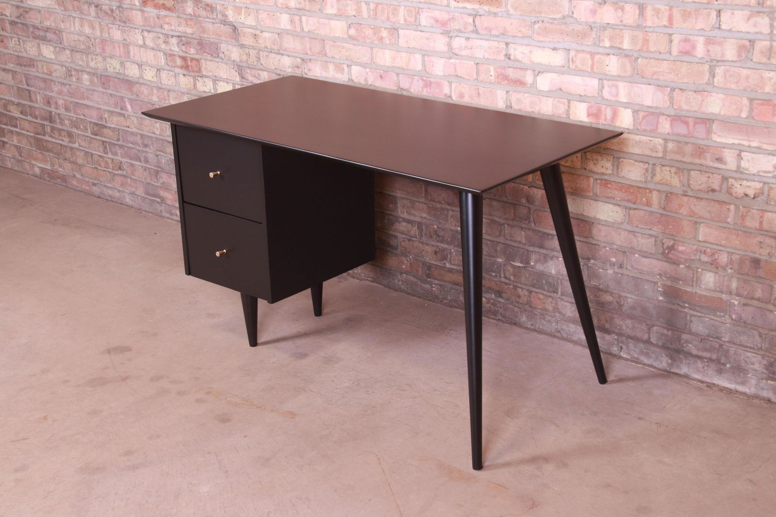 Paul McCobb Planner Group Mid-Century Modern Writing: An exceptional minimalist mid-century modern writing desk By Paul McCobb for Winchendon Furniture "Planner Group" USA 1950s Black lacquered solid maple with original brass hardware. Measures: 48"W x 2