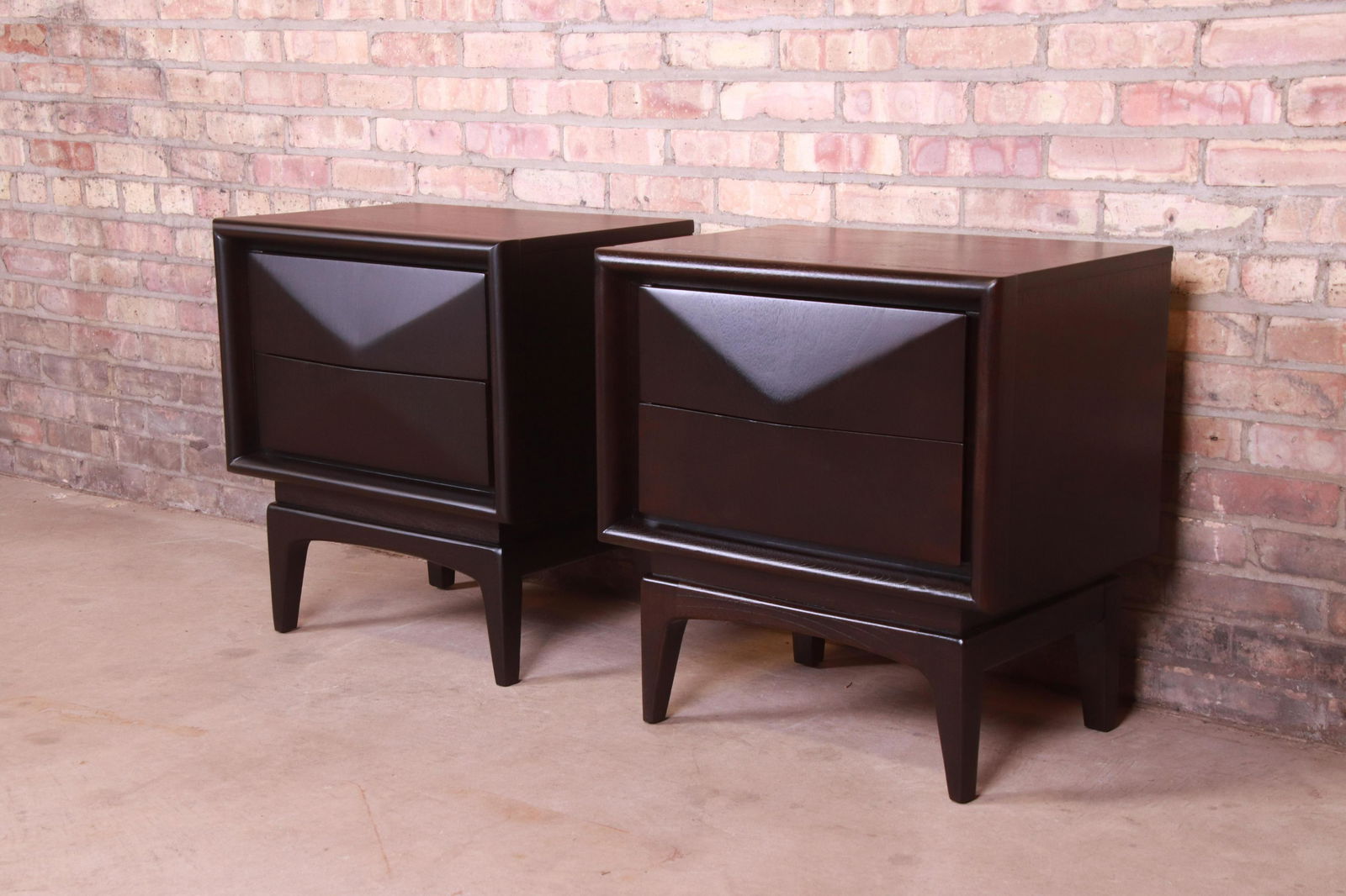Mid-Century Modern Ebonized Sculpted Walnut Diamond: A stunning pair of mid-century modern diamond front nightstands In the manner of Vladimir Kagan By United Furniture Co. USA 1960s Ebonized walnut with unique sculpted diamond front design. Measures: 2