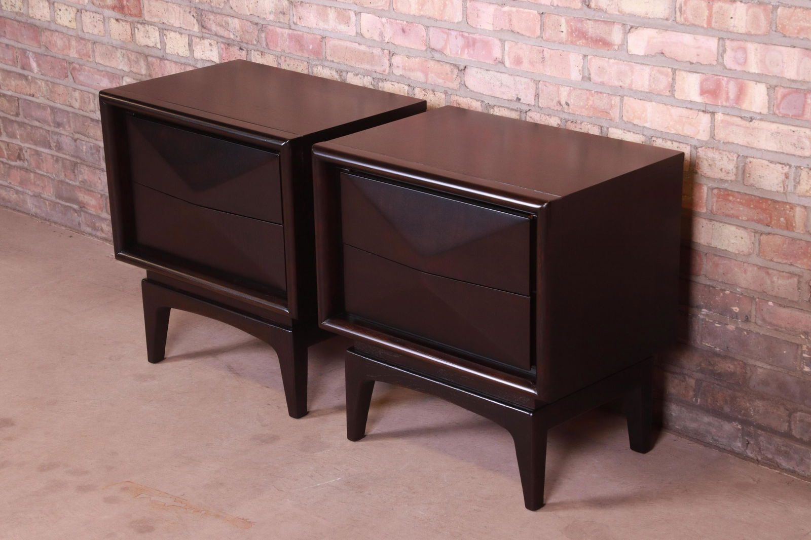 Mid-Century Modern Ebonized Sculpted Walnut Diamond: A stunning pair of mid-century modern diamond front nightstands In the manner of Vladimir Kagan By United Furniture Co. USA 1960s Ebonized walnut with unique sculpted diamond front design. Measures: 2