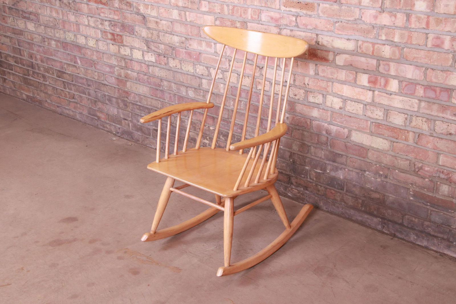 Russel Wright for Conant Ball Solid Birch Rocking Chair: A gorgeous mid-century modern solid birch spindle back rocking chair By Russel Wright for Conant Ball USA 1950s Measures: 24"W x 28"D x 36.5"H. Seat height 16.25"; arm height 24". Good original vintag
