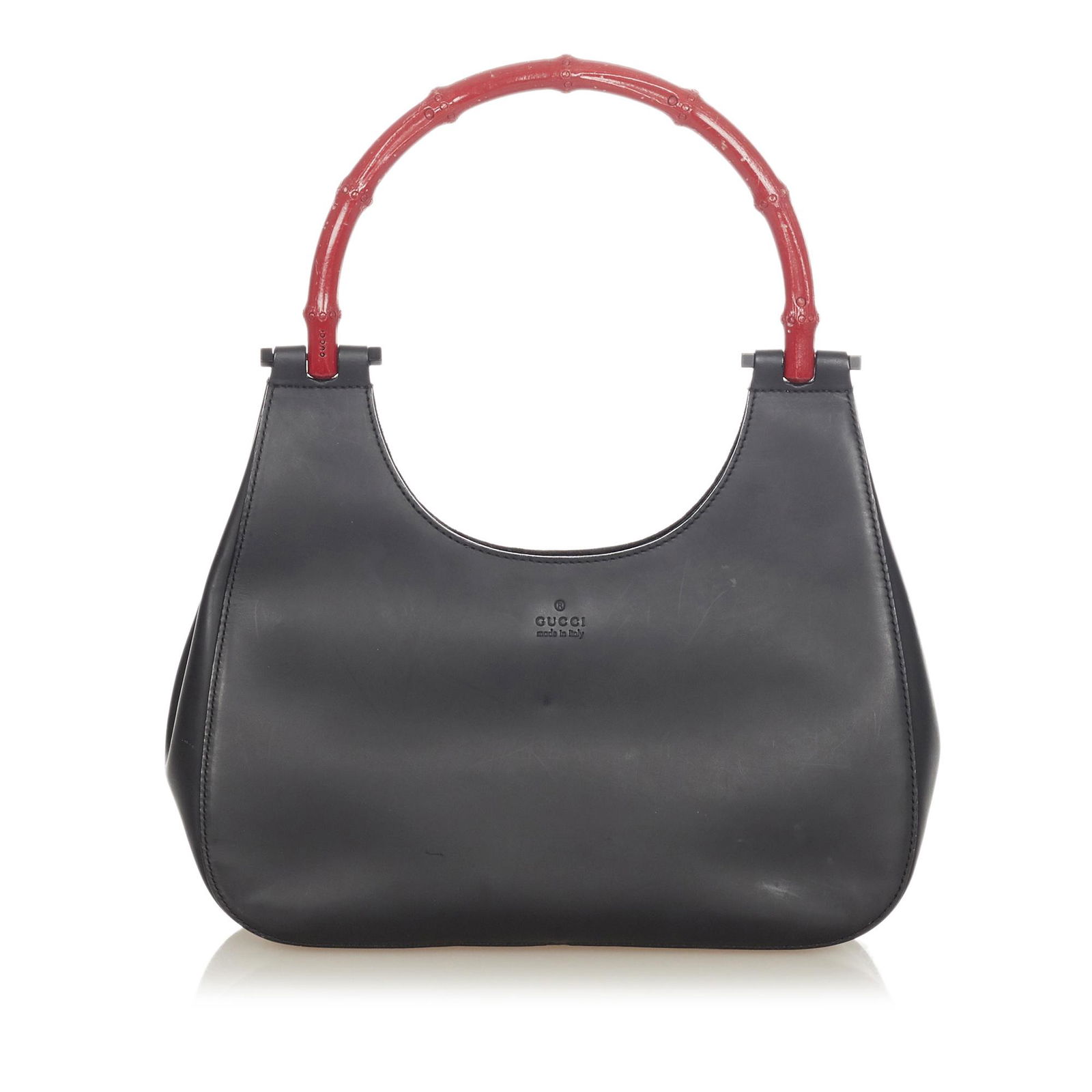 Authentic Gucci Bamboo Leather Handbag: This item qualifies for FREE DOMESTIC SHIPPING to customers in the USA This handbag features a leather body a bamboo top handle an open top with magnetic closure and an interior zip pocket. Brand: Guc
