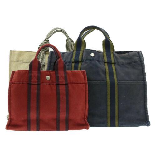 Authentic HERMES Fourre Tout PM MM Hand Bag Navy Red: This item qualifies for FREE DOMESTIC SHIPPING to customers in the USA Brand: HERMES Size: W30 x H22 x D9cm(Approx) Color: Navy / Red / Beige Country/Region of Manufacture: France Material: 100% Cotto