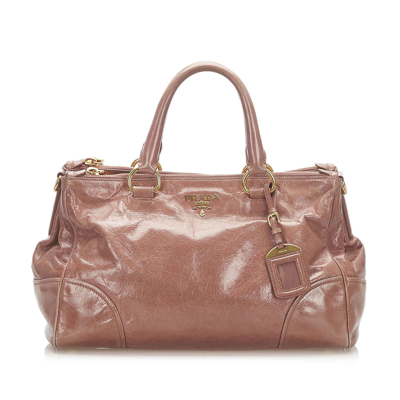 Authentic Prada Vitello Shine Satchel: This item qualifies for FREE DOMESTIC SHIPPING to customers in the USA This satchel features a leather body rolled leather handles a detachable flat leather strap a top zip closure and an interior zip