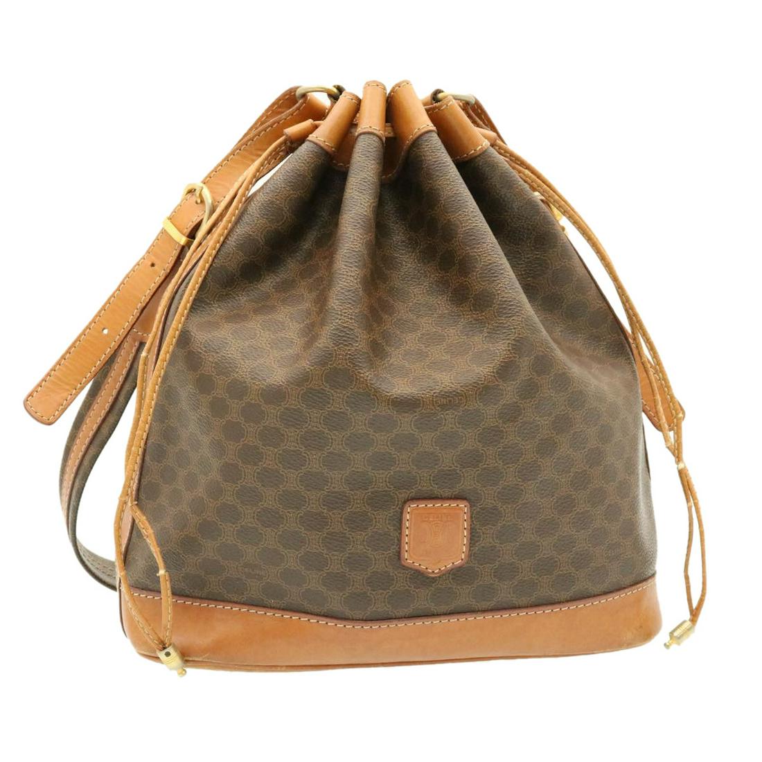Authentic CELINE Macadam Canvas Shoulder Bag PVC: This item qualifies for FREE DOMESTIC SHIPPING to customers in the USA Brand: CELINE Style: Shoulder Bag Material: PVC Leather / Macadam Canvas Color: Brown Made In: Italy Size (Inches): W10.2 x H11.8