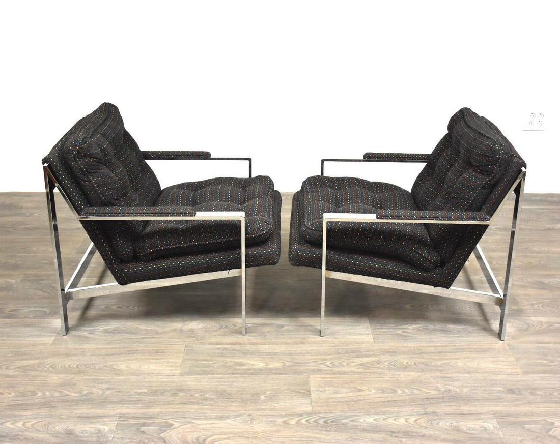 1970s Cy Mann Chrome Club Chairs - a Pair: A great pair of mid century modern chrome framed lounge chairs designed by Cy Mann in the style of Milo Baughman. Black fabric is in excellent condition. Photos donâ€™t do this pair justice! Seat