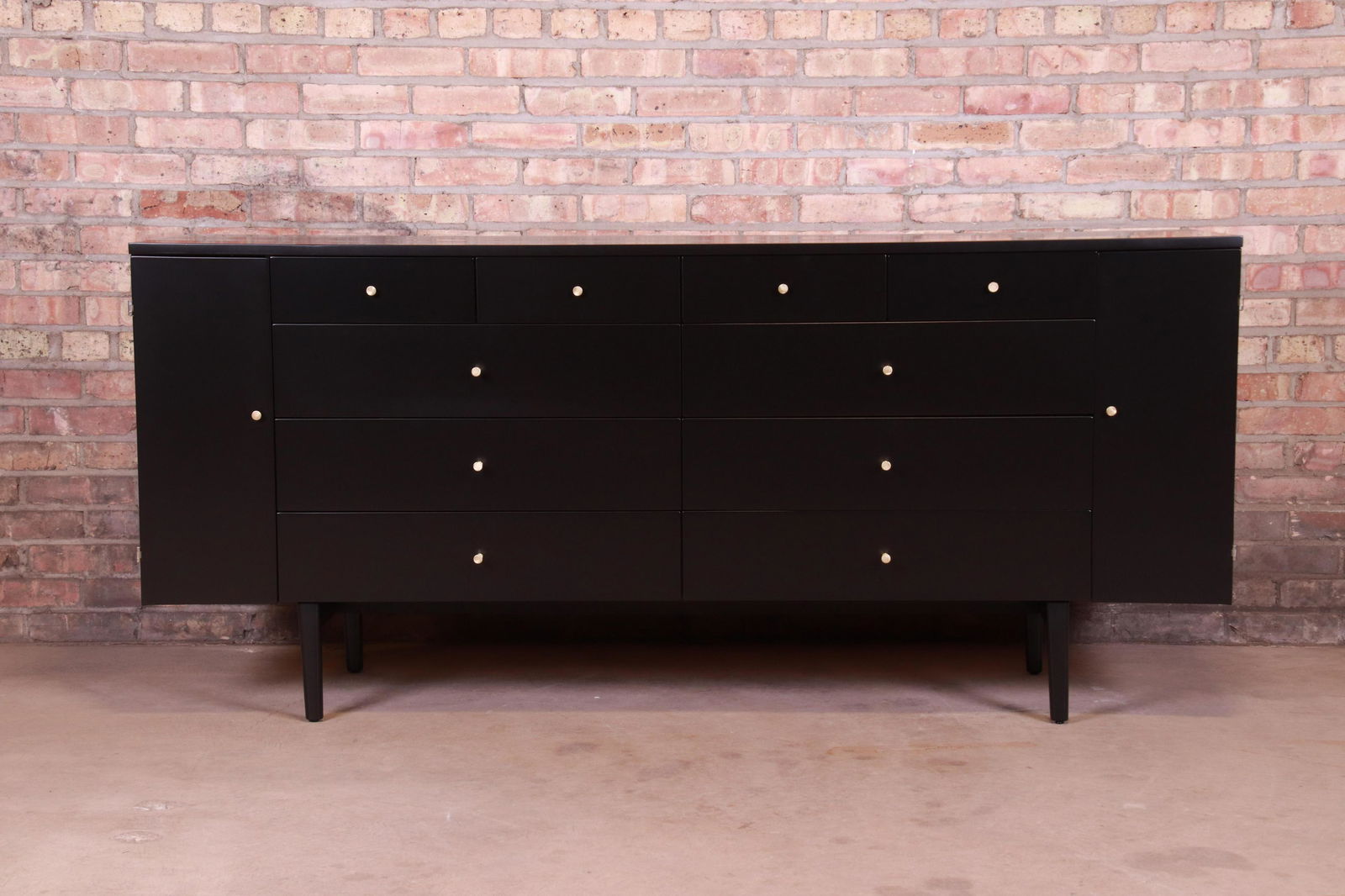 Paul McCobb Planner Group Black Lacquered 20-Drawer: A rare and exceptional mid-century modern 20-drawer dresser or credenza By Paul McCobb for Winchendon Furniture "Planner Group" USA 1950s Black lacquered solid birch with original brass hardware. Meas