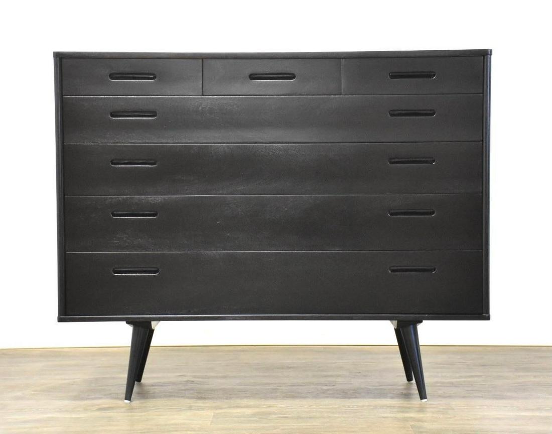 Edward Wormley for Dunbar Ebonized Black Dresser Chest: A mid century modern seven drawer dresser professionally refinished in an ebonized black finish designed by Edward Wormley for Dunbar with added legs. Signed Dunbar. 46” wide. 20” deep. 37