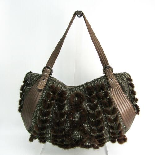 Authentic Salvatore Ferragamo Gancini EZ-21 6956: This item qualifies for FREE DOMESTIC SHIPPING to customers in the USA Brand: Salvatore Ferragamo Occasion: Business Material: Leather Fur Cotton Country/Region Of Manufacture: Italy Style: Handbag Pe