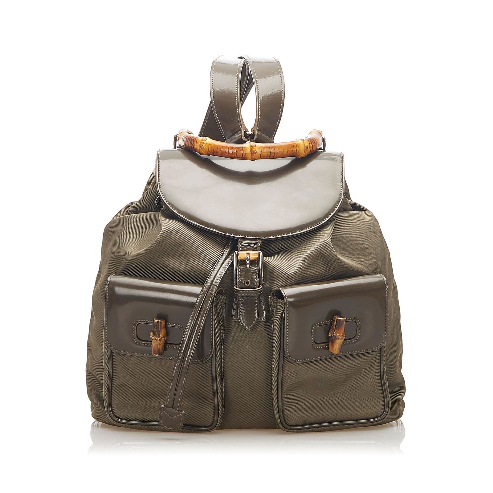 Authentic Gucci Bamboo Drawstring Nylon Backpack: This item qualifies for FREE DOMESTIC SHIPPING to customers in the USA The Bamboo backpack features a nylon body with leather trim exterior front flap pockets with bamboo bullet and twist lock closure