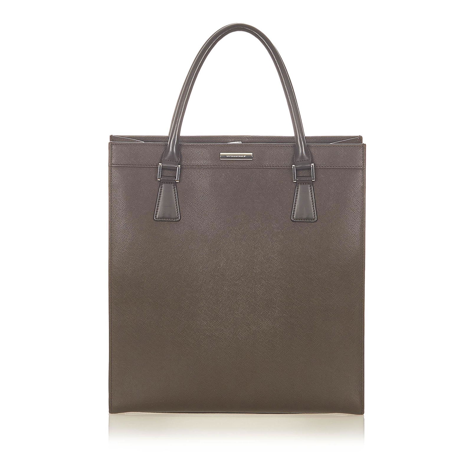 Authentic Burberry Leather Tote Bag: This item qualifies for FREE DOMESTIC SHIPPING to customers in the USA This tote bag features a leather body rolled handles an open top an interior zip compartment and an interior zip pocket. Brand: B