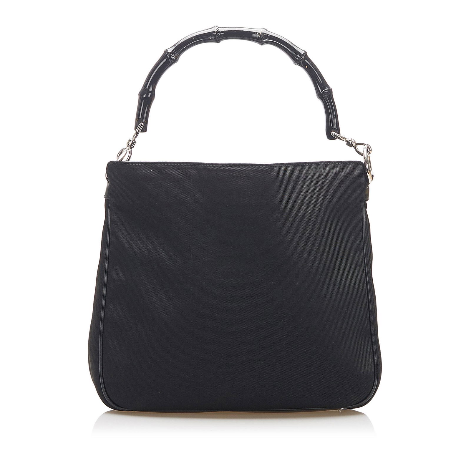 Authentic Gucci Bamboo Canvas Satchel: This item qualifies for FREE DOMESTIC SHIPPING to customers in the USA This satchel features a canvas body a bamboo top handle a flat leather strap an open top with a magnetic clasp closure and an int