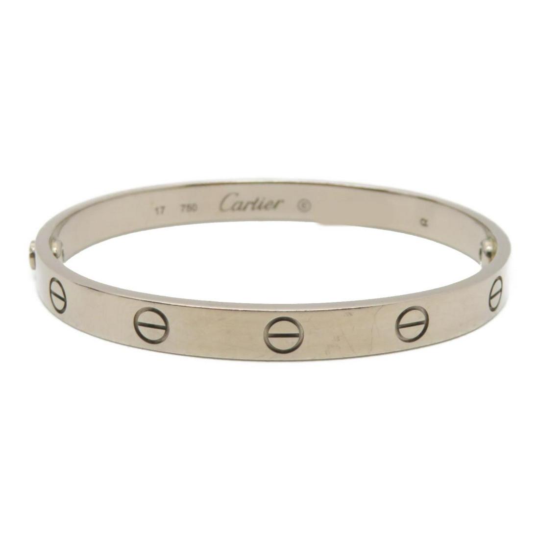 Authentic Cartier Love Blaceret 750: This item qualifies for FREE DOMESTIC SHIPPING to customers in the USA Cartier Love Blaceret 750 The BIDHAUS Guarantee: Photos descriptions and estimates were prepared with the utmost care by our team