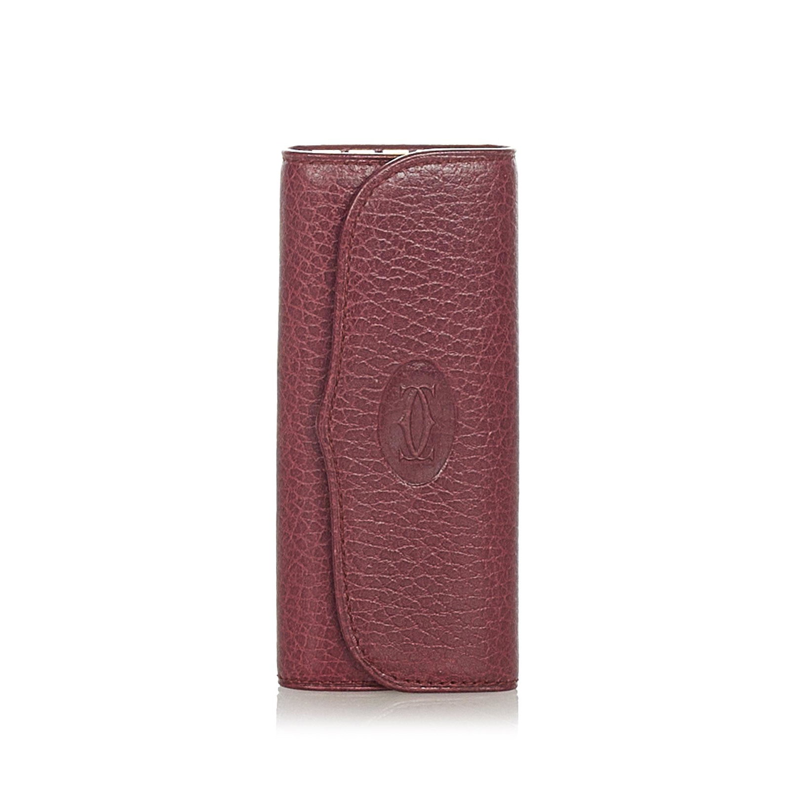 Authentic Must De Cartier Leather Key Holder: This item qualifies for FREE DOMESTIC SHIPPING to customers in the USA This key holder features a leather body a front flap with snap button closure and gold-tone key holders. Brand: Cartier Model: Mu