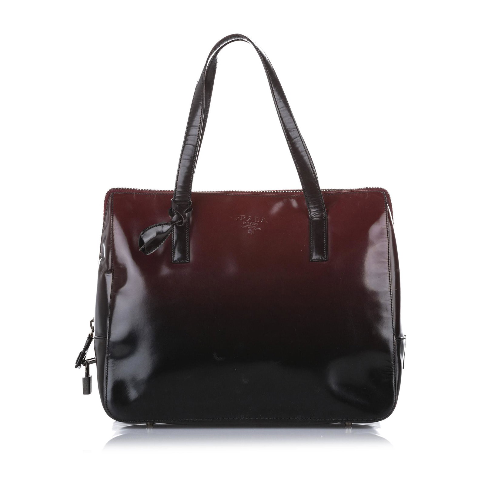Authentic Prada Patent Leather Handbag: This item qualifies for FREE DOMESTIC SHIPPING to customers in the USA This handbag features a patent leather body flat leather handles and a top zip closure. Brand: Prada Model: Patent Leather Handba