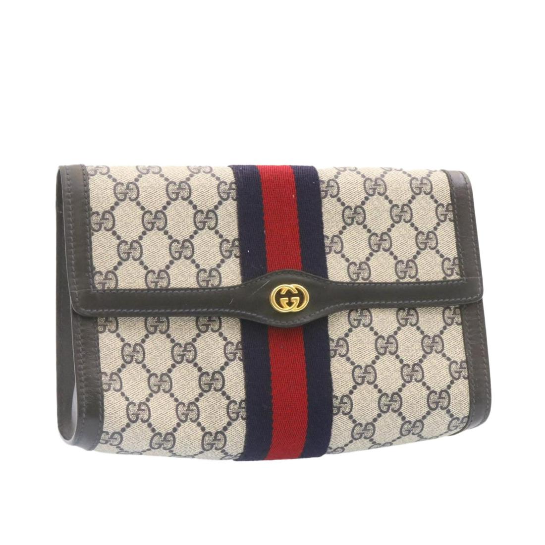 Authentic GUCCI Sherry Line GG Canvas Clutch Bag Navy: This item qualifies for FREE DOMESTIC SHIPPING to customers in the USA Brand: GUCCI Style: Clutch Bag Material: PVC Leather / GG Canvas Color: Navy / Red Made In: Italy Size (Inches): W9.8 x H6.3 x D2