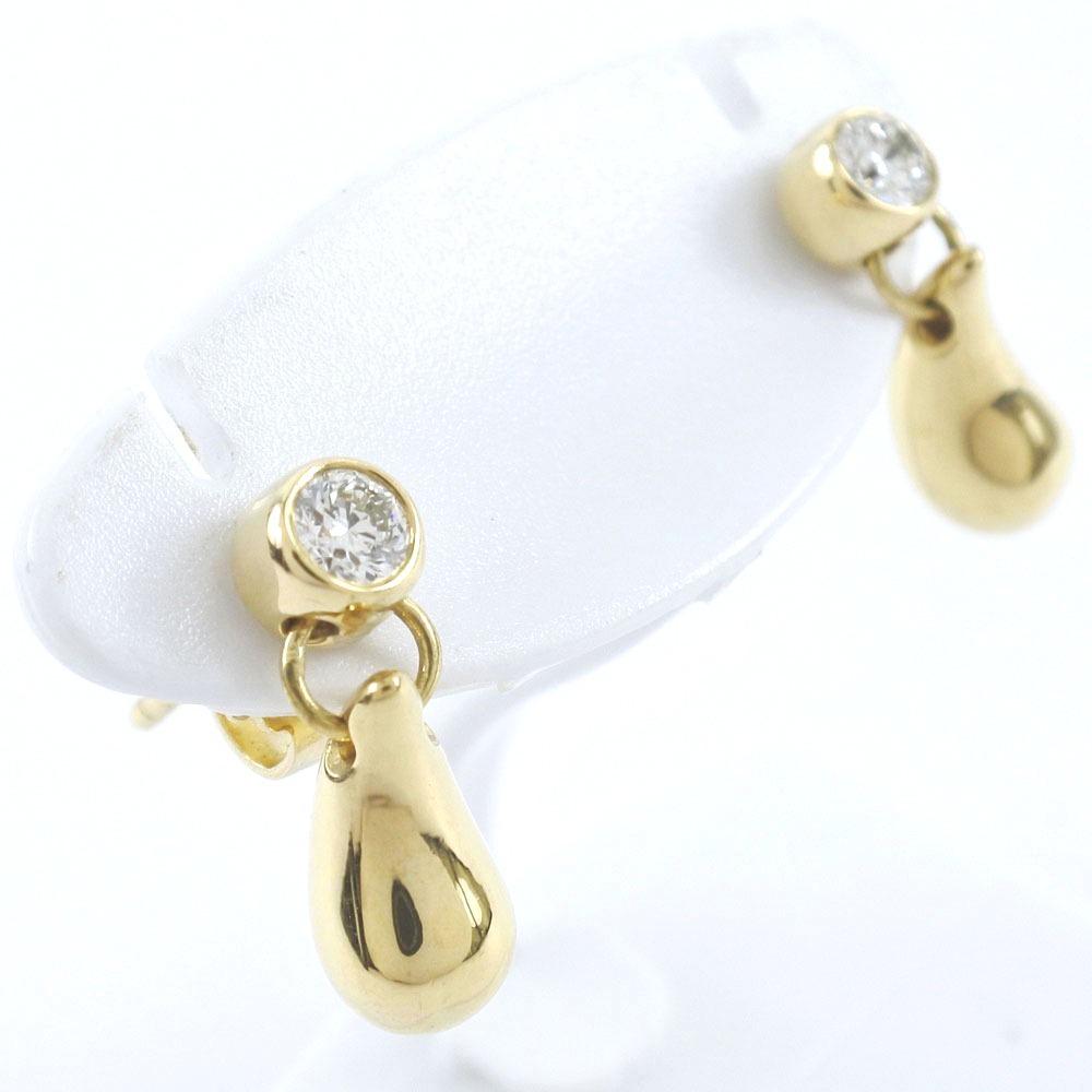Authentic TIFFANY & Co. Elsa Peretti K18 Yellow Gold: Brand: Tiffany Accessories: Dust bag Condition: Used (very good) Material: Yellow gold (18K) Size (HxWxD): 14mm x 4mm / 0.55'' x 0.15'' Weight: 3.9g / 0.13oz. Overall Traces of Use: Slight Stone: Diam