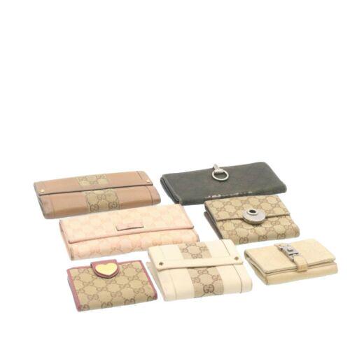 Authentic GUCCI GG Canvas Wallet 7Set Brown Pink Black: This item qualifies for FREE DOMESTIC SHIPPING to customers in the USA Brand: Gucci Style: Wallet Material: Gg Canvas Color: Brown / Pink / Black Department: Women Country Of Manufacture: Italy Type: