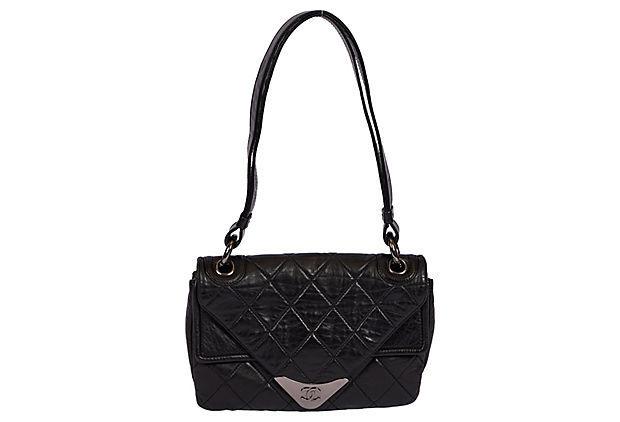 Authentic Chanel Black Envelope Shoulder Bag: This item qualifies for FREE DOMESTIC SHIPPING to customers in the USA Condition: Excellent Era: Contemporary; 2000s Dimensions: 9" L x 2" W x 6.5" H Materials: leather metal Color: black silver Chane