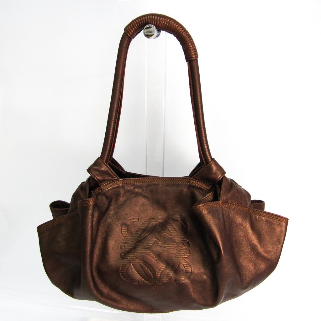 Authentic Loewe Nappa Aire Women's Leather Handbag: This item qualifies for FREE DOMESTIC SHIPPING to customers in the USA Brand: Loewe Type: Handbag Gender: Women Condition: Used (very good) Line: Nappa Aire Material: Leather Color: Bronze Size (HxWxD