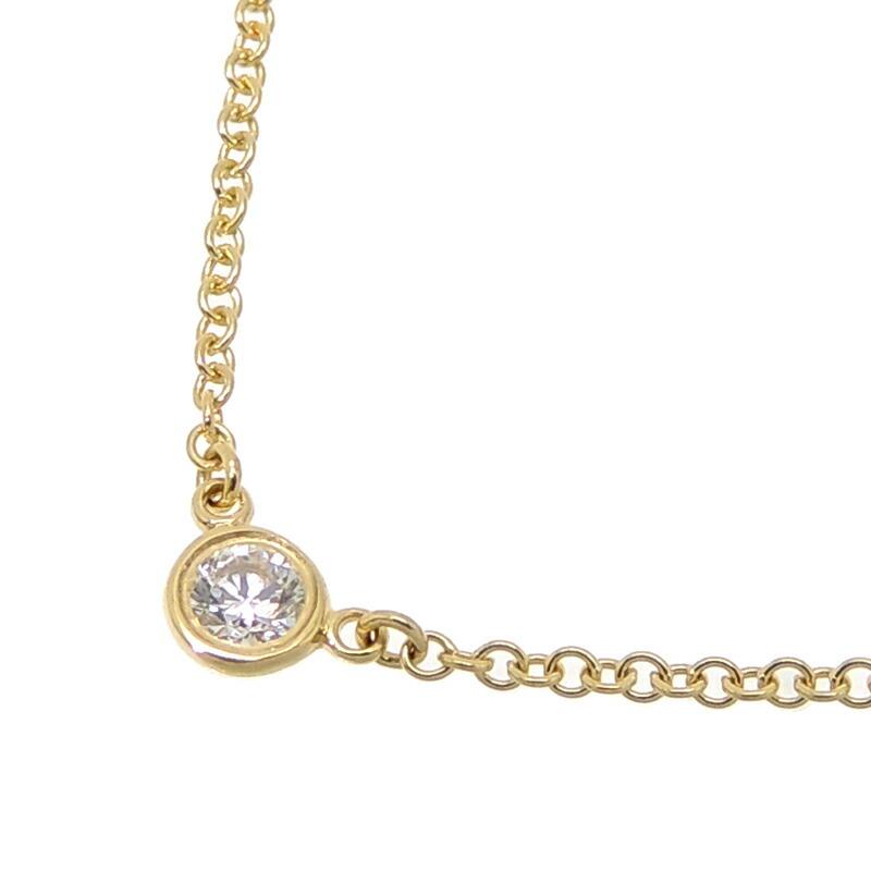 Authentic Tiffany 750YG Diamond by the Yard Women's: This item qualifies for FREE DOMESTIC SHIPPING to customers in the USA Brand: Tiffany Line: Diamonds by the Yard Model: By the Yard Necklace Material: Yellow gold Color: Yellow Condition: Used (very g