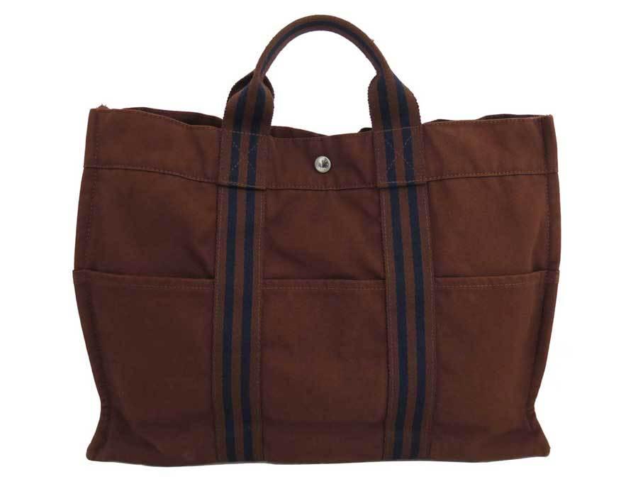 Authentic Hermes Bag Fool Toe MM Brown Navy Silver: This item qualifies for FREE DOMESTIC SHIPPING to customers in the USA Brand: Hermes Model: Fool to MM Type: Handbag, Tote bag Material: Cotton Color: Brown, Navy Size (HxWxD): 32cm x 42.5cm x 10.5cm 